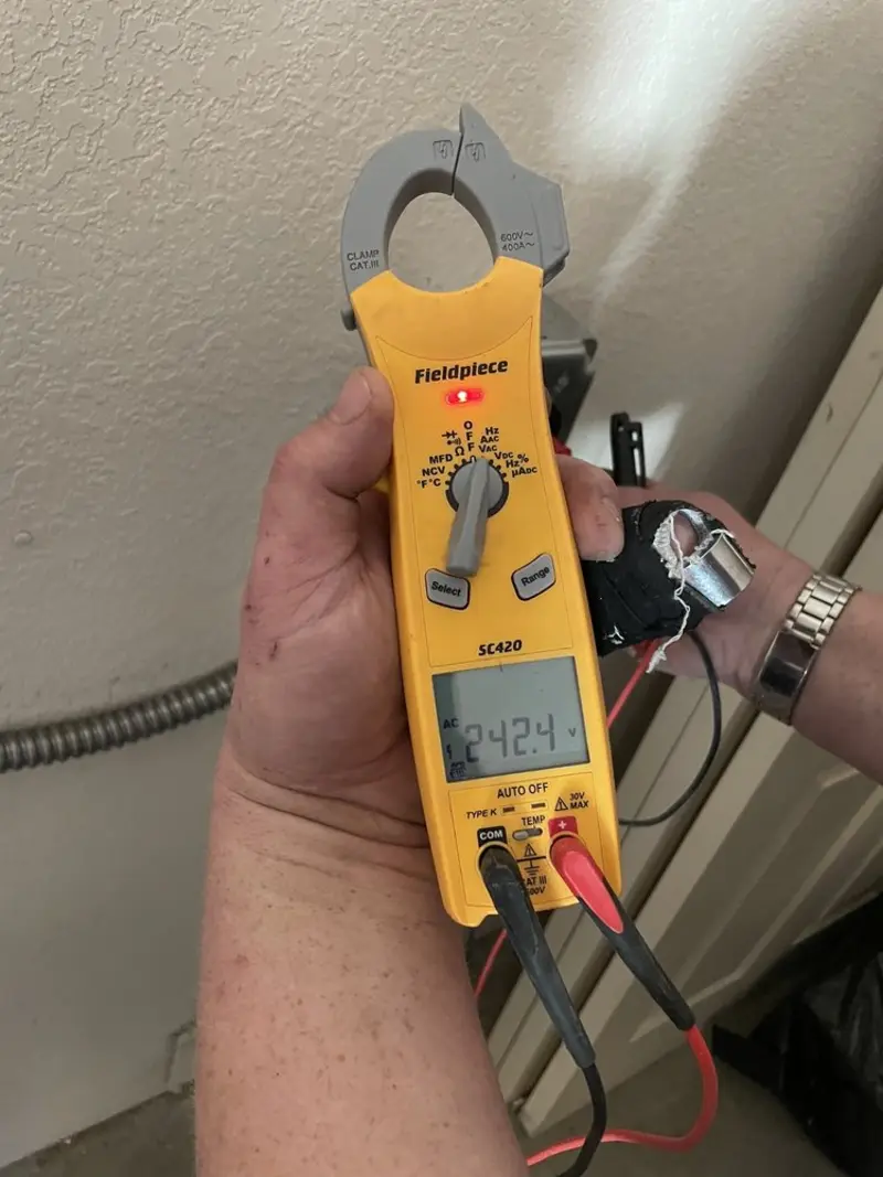 Voltage testing with clamp meter during Recessed Lighting Installation in Salem